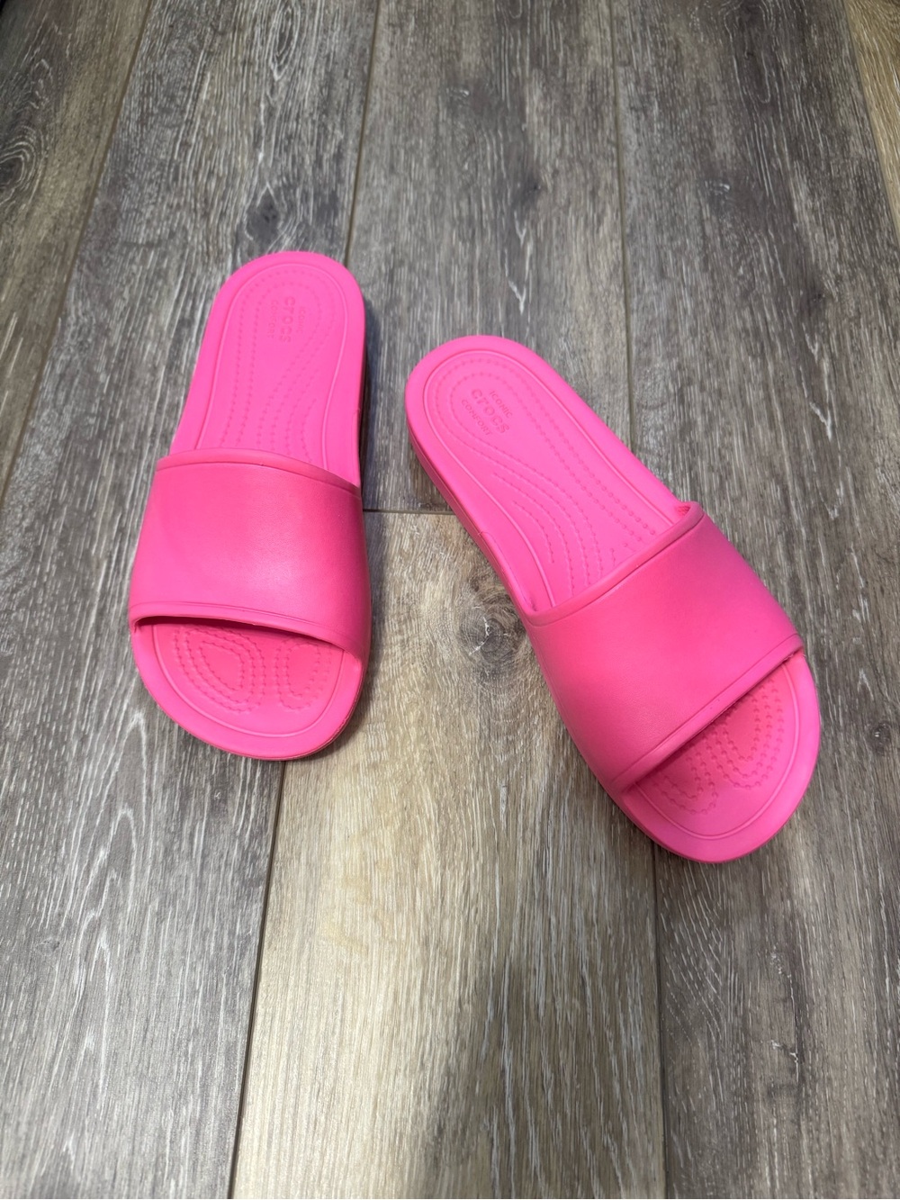 CROCS Iconic Comfort Slide Sandals in Bright Pink